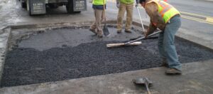 workers on utility cut